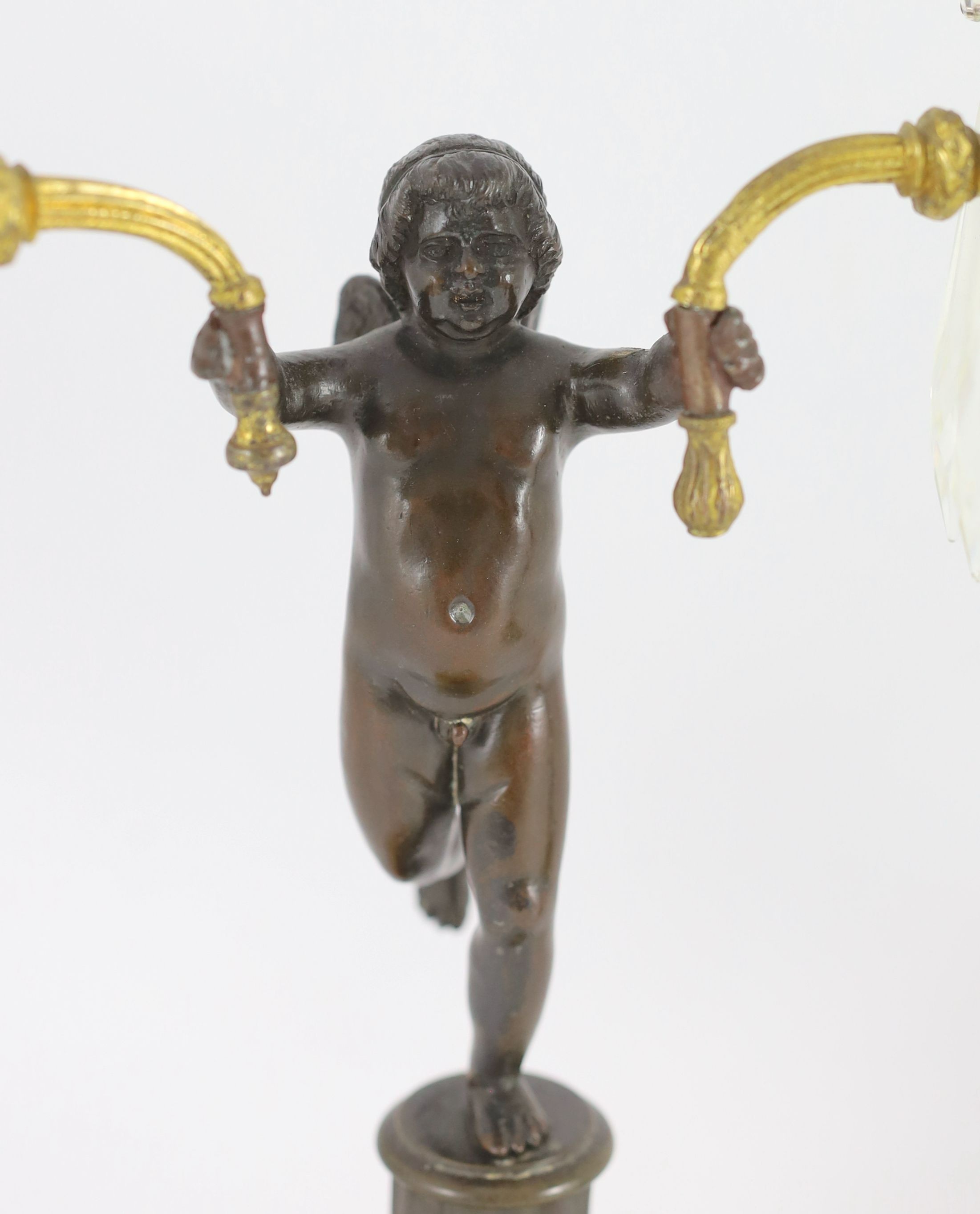 A pair of early 19th century bronze and ormolu figural candelabra, width 30cm, height 42cm